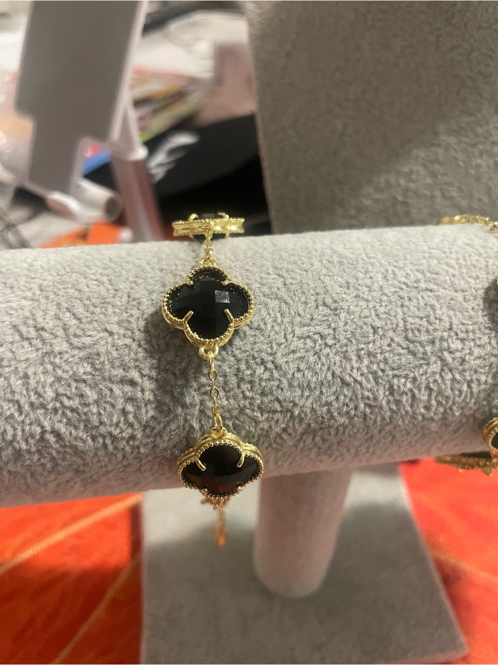 Elegant Gold Bracelet with Black Clover Stones